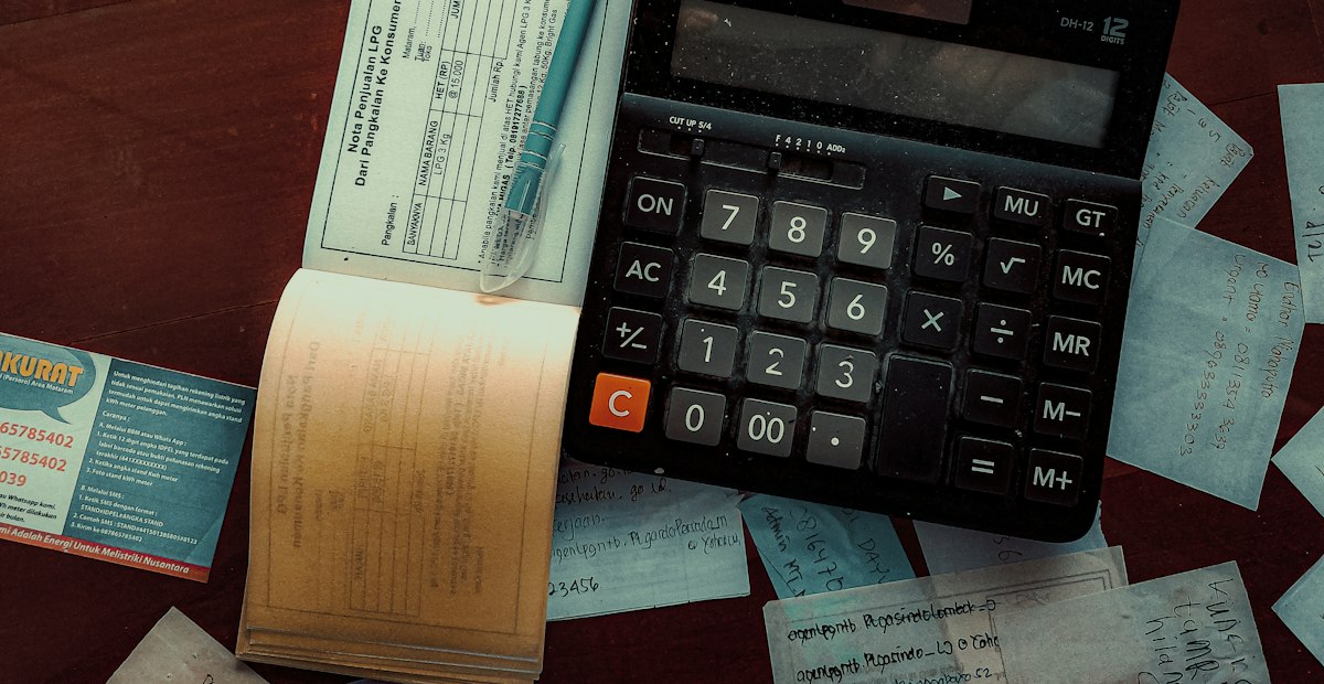 A calculator on a wooden table
